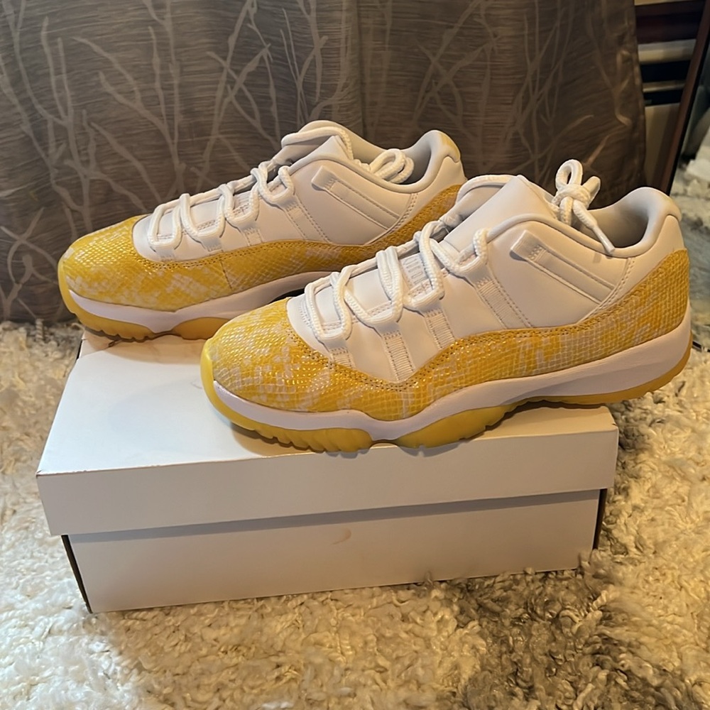 Yellow and white women’s air jordan retro low 11s BNIB